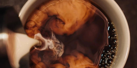 Coffee being poured into a mug