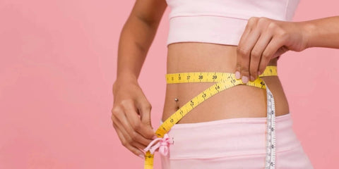 Woman measuring waist