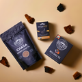 Loose Chaga Tea, ChagaNOW and Chaga Tea Bags with scattered chaga chunks