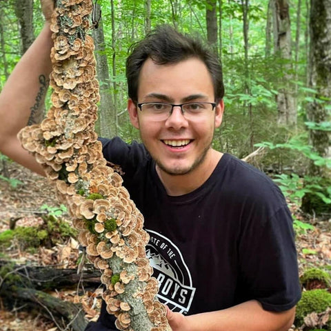 Garrett Kopp and Turkey Tail Mushroom Log