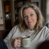 Gift wrap with photo of a woman holding a coffee mug in a cozy room