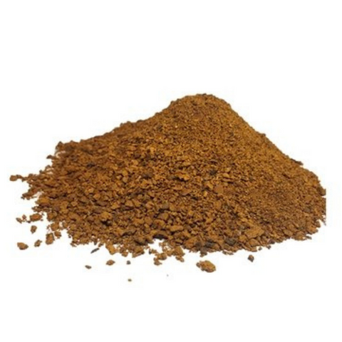 Wild chaga mushroom powder, brown ground granules mound