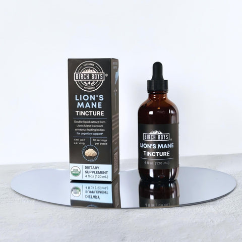 Lion's Mane Extract bottle and packaging on a reflective surface with a white background