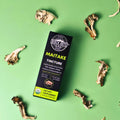 Birch Boys Maitake Tincture box on a green background with dried maitake mushrooms.